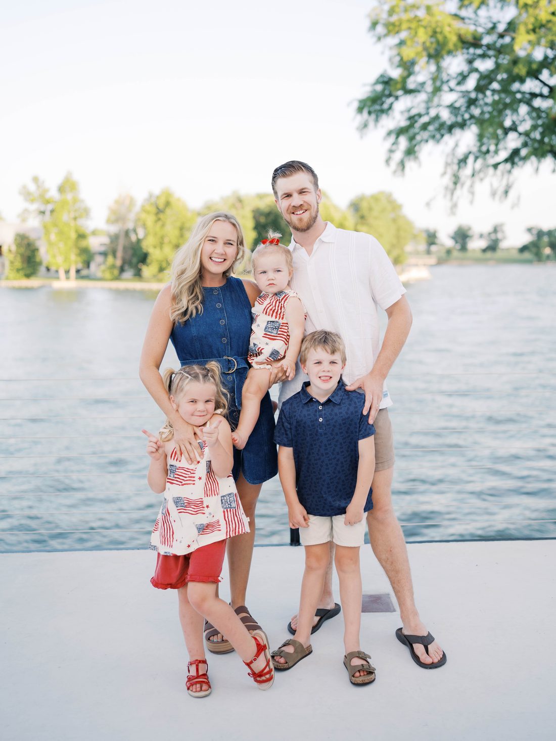 Josh and Bailey Jack with their three kids on a dock in Central Texas