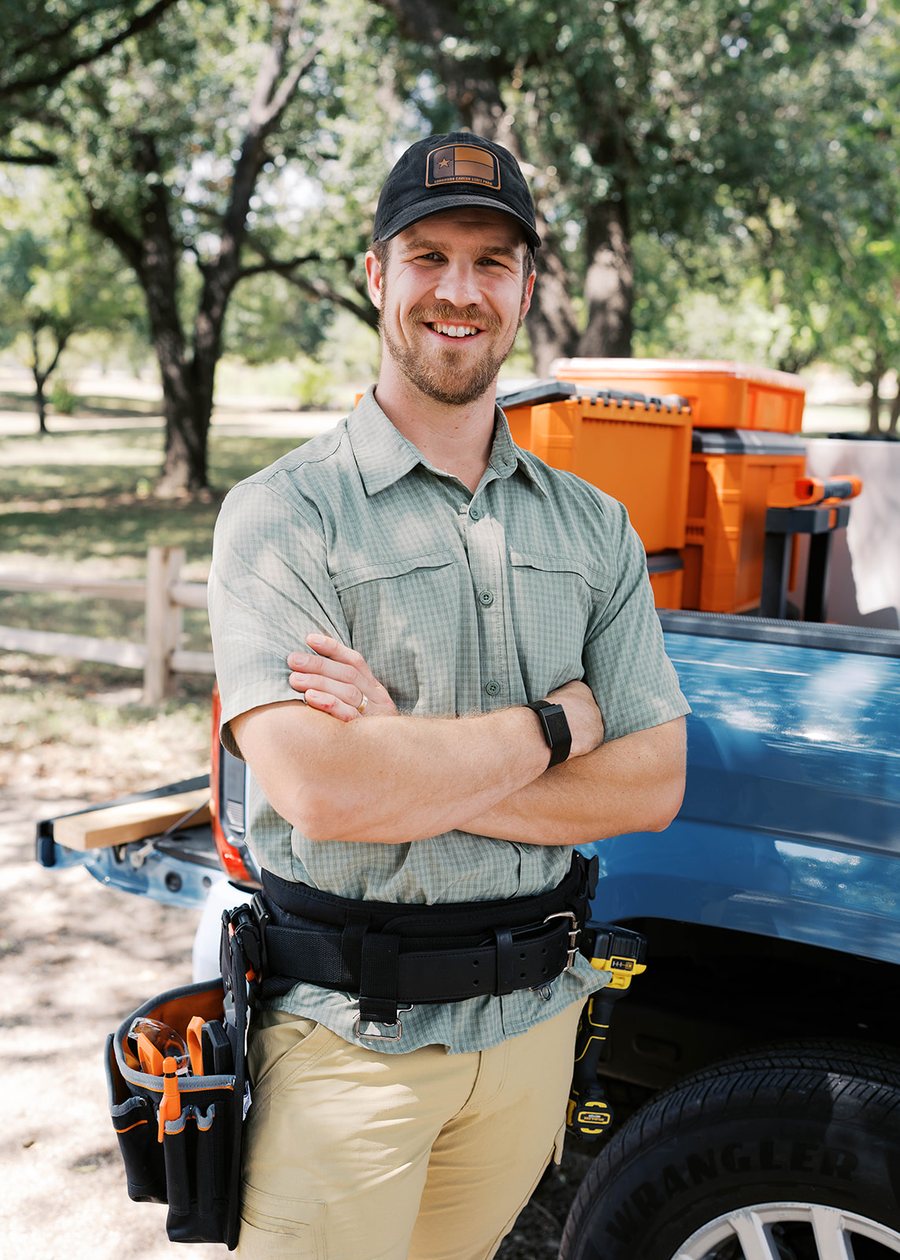 Josh Jack of Nine Banded Handyman beside his truck in Georgetown, Texas